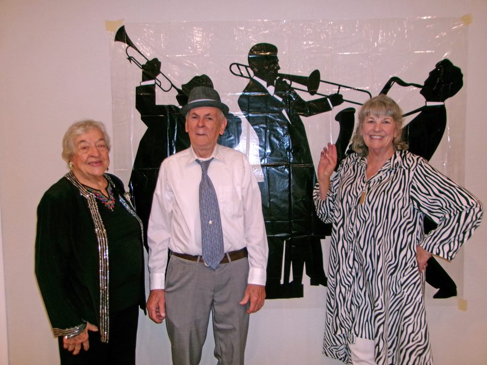 Adrianne, Lisa, Julia, Melissa and Adrianna from Glendora and Orange County enjoyed last year’s Brewfest at Tavern Bay Beach Club so much they couldn’t resist attending this year’s event. (Photos by Douglas W. Motley) Three people posing in front of jazz musicians silhouette.