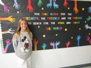Fourth-grader Izzie Barba stands ready to make the world a better place.