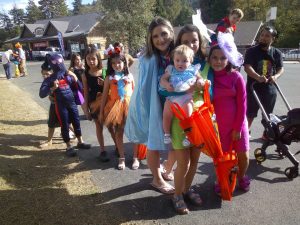 Colorfully dressed trick or treaters on Lake Drive.