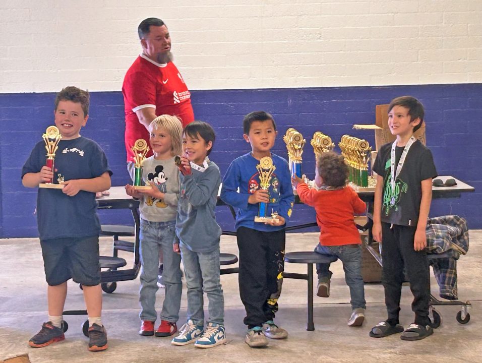 The winners of the elementary school division proudly display their trophies.