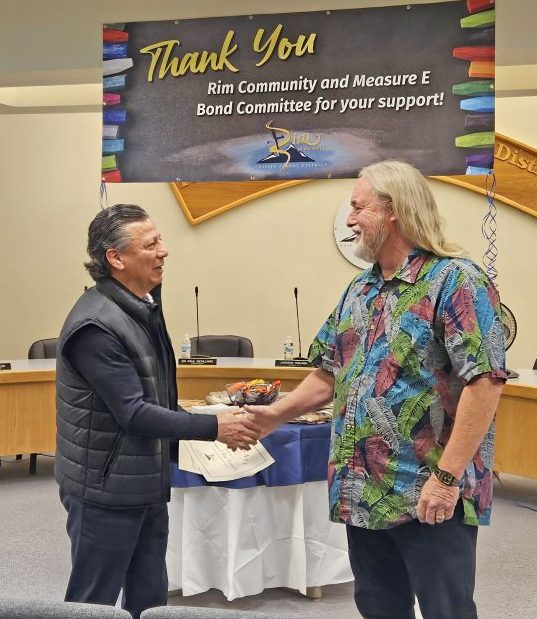 Dr. Paul Sevillano (left), the Rim superintendent of schools, thanks Paul Bonaccorsi for chairing the Yes on Measure E committee. (Photos by Mary-Justine Lanyon)