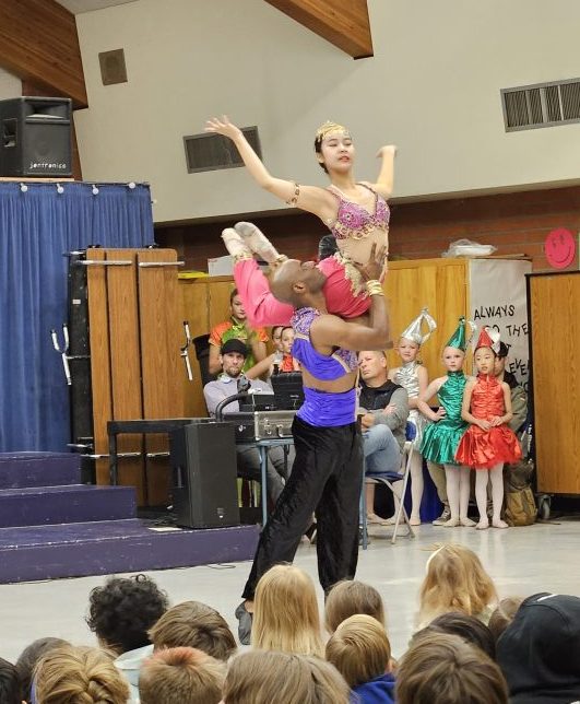 Tomlin lifts Nina Hidajat in the Arabian dance; the lifts drew gasps from the students.