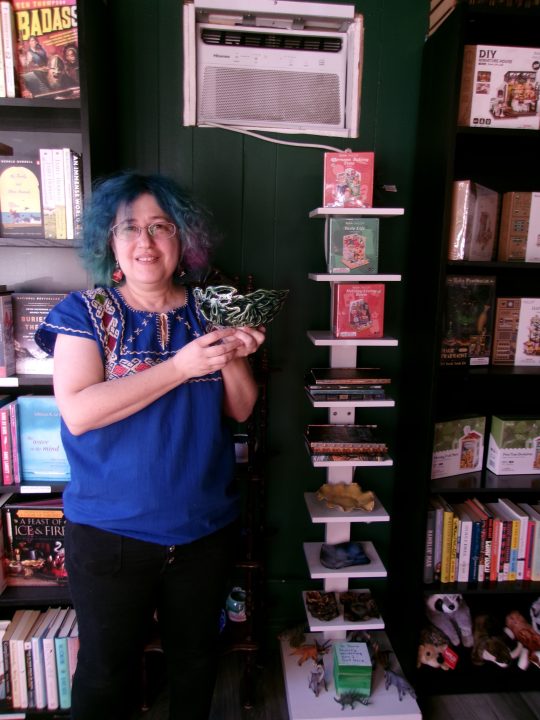 Adrianne, Lisa, Julia, Melissa and Adrianna from Glendora and Orange County enjoyed last year’s Brewfest at Tavern Bay Beach Club so much they couldn’t resist attending this year’s event. (Photos by Douglas W. Motley) Person holding ceramic bowl in bookstore.