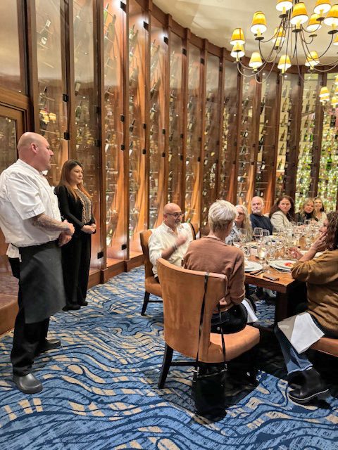 People dining in an elegant restaurant setting.