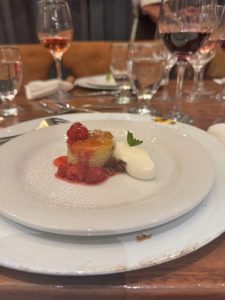 The meal concluded with a semolina cake topped with raspberries and cream.