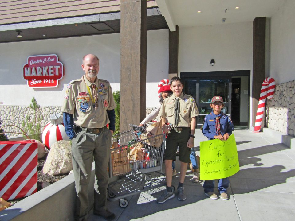 Adrianne, Lisa, Julia, Melissa and Adrianna from Glendora and Orange County enjoyed last year’s Brewfest at Tavern Bay Beach Club so much they couldn’t resist attending this year’s event. (Photos by Douglas W. Motley) Boy Scouts collecting canned goods outside market.