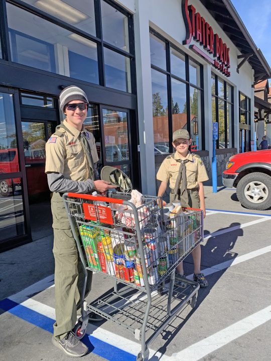 Adrianne, Lisa, Julia, Melissa and Adrianna from Glendora and Orange County enjoyed last year’s Brewfest at Tavern Bay Beach Club so much they couldn’t resist attending this year’s event. (Photos by Douglas W. Motley) Two scouts with grocery cart outside supermarket.