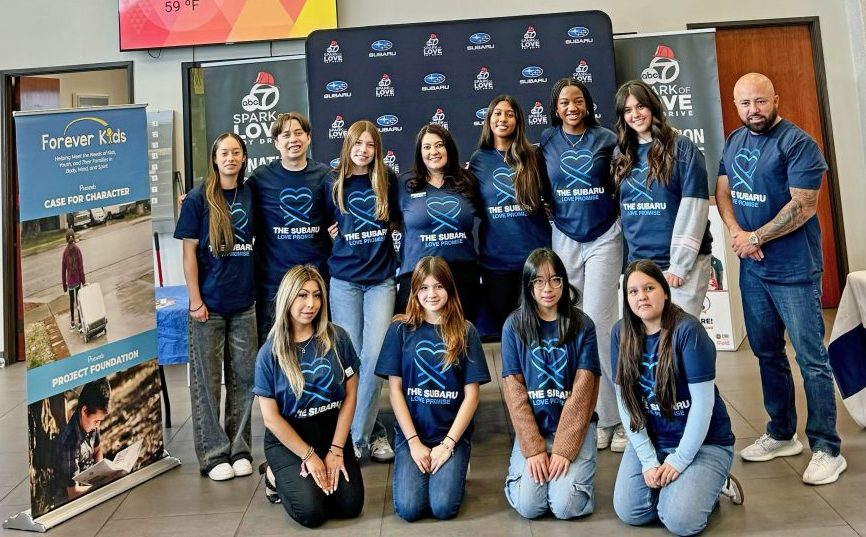Adrianne, Lisa, Julia, Melissa and Adrianna from Glendora and Orange County enjoyed last year’s Brewfest at Tavern Bay Beach Club so much they couldn’t resist attending this year’s event. (Photos by Douglas W. Motley) Team posing at Subaru charity event backdrop.