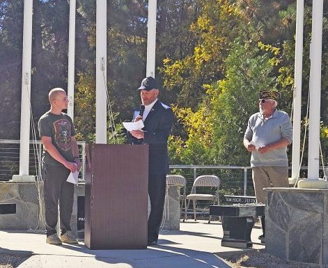 Jack Lindeman gave his Patriot’s Pen essay after being presented with a check by Jay Rynda and Joe Aquino (right).