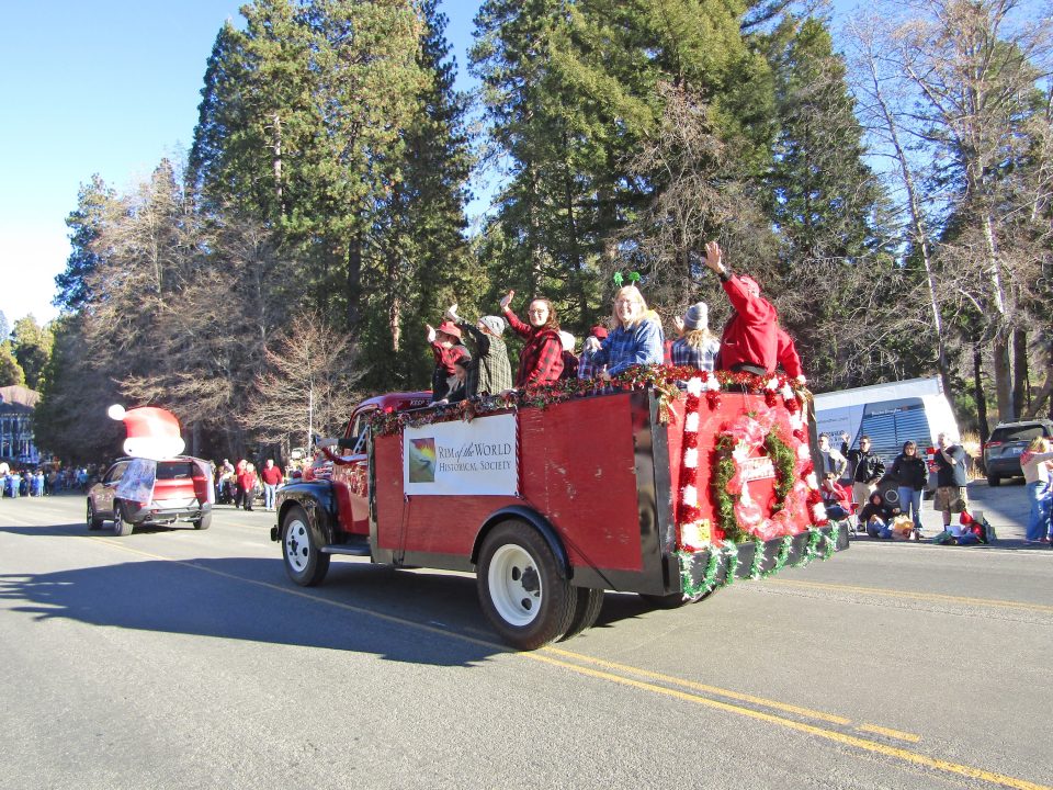 Adrianne, Lisa, Julia, Melissa and Adrianna from Glendora and Orange County enjoyed last year’s Brewfest at Tavern Bay Beach Club so much they couldn’t resist attending this year’s event. (Photos by Douglas W. Motley) Festive parade float with people waving.