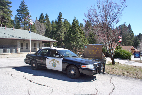 Highway patrol car parked near station