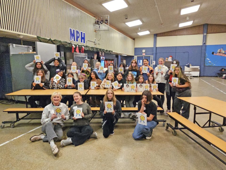 Adrianne, Lisa, Julia, Melissa and Adrianna from Glendora and Orange County enjoyed last year’s Brewfest at Tavern Bay Beach Club so much they couldn’t resist attending this year’s event. (Photos by Douglas W. Motley) Group holding books in school cafeteria.