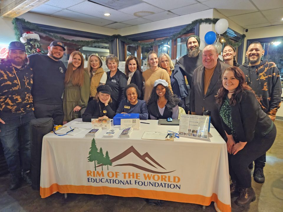 Group photo supporting educational foundation event.