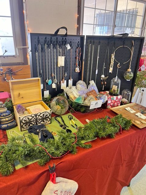 Adrianne, Lisa, Julia, Melissa and Adrianna from Glendora and Orange County enjoyed last year’s Brewfest at Tavern Bay Beach Club so much they couldn’t resist attending this year’s event. (Photos by Douglas W. Motley) Handmade jewelry and crafts displayed on festive table.