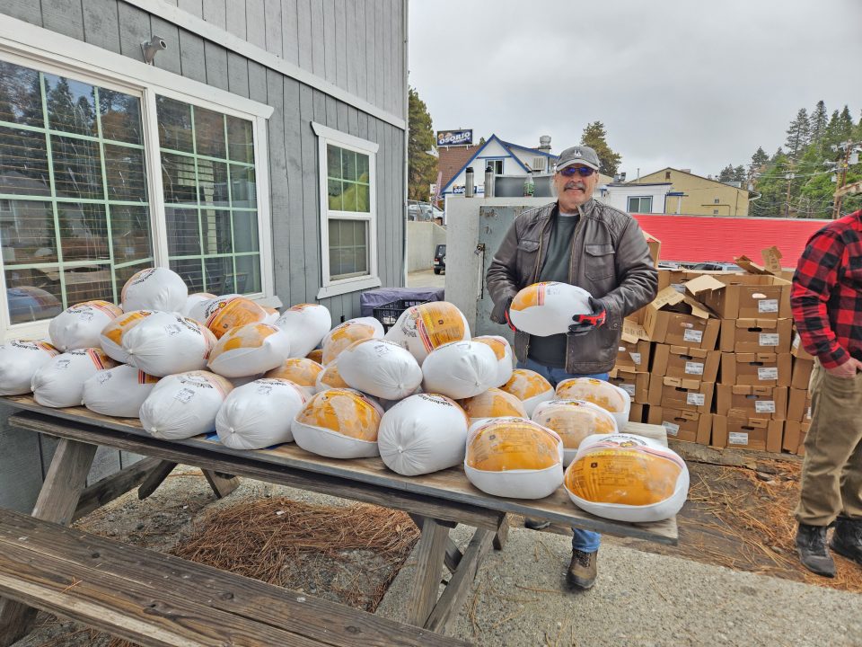 Adrianne, Lisa, Julia, Melissa and Adrianna from Glendora and Orange County enjoyed last year’s Brewfest at Tavern Bay Beach Club so much they couldn’t resist attending this year’s event. (Photos by Douglas W. Motley) Man with packaged turkeys on outdoor table
