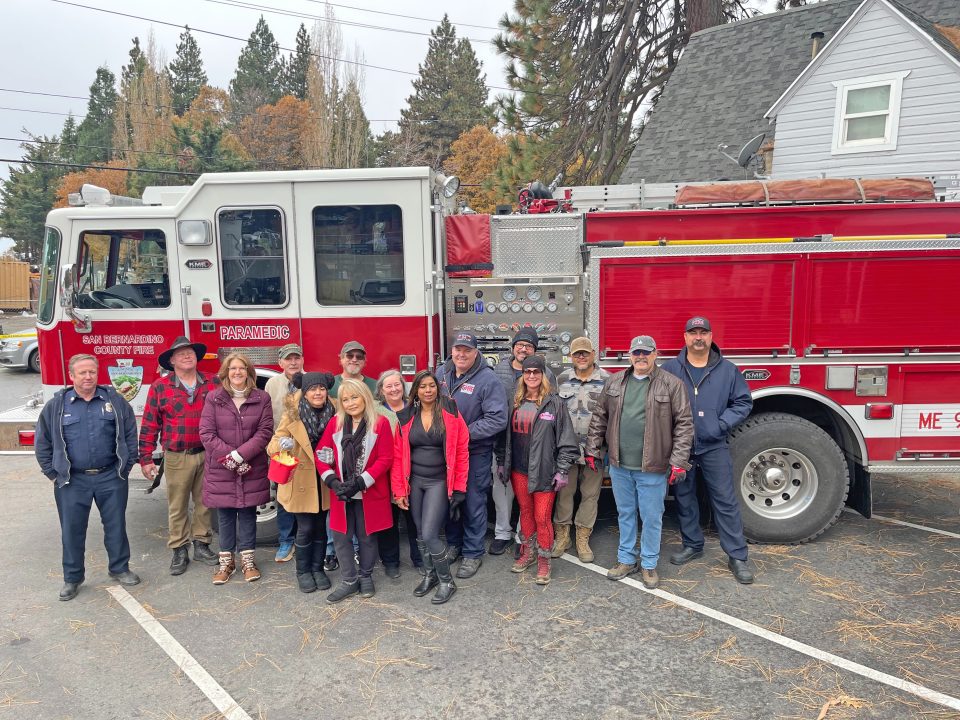 Firefighters from County Fire Station 94 with Holland Lowe and her volunteers. (Photo by Mary-Justine Lanyon)