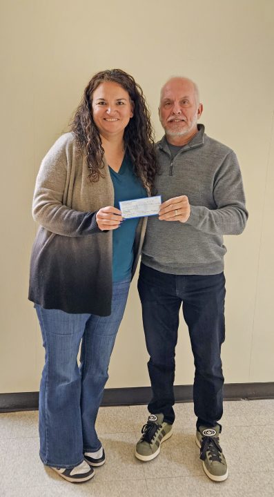 Meghan and Matt Murphey presented the school district with a $2,000 donation.