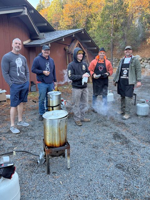 The crew that fried the turkeys behind the San Moritz Lodge. (Photo by Shelley Hughes)
