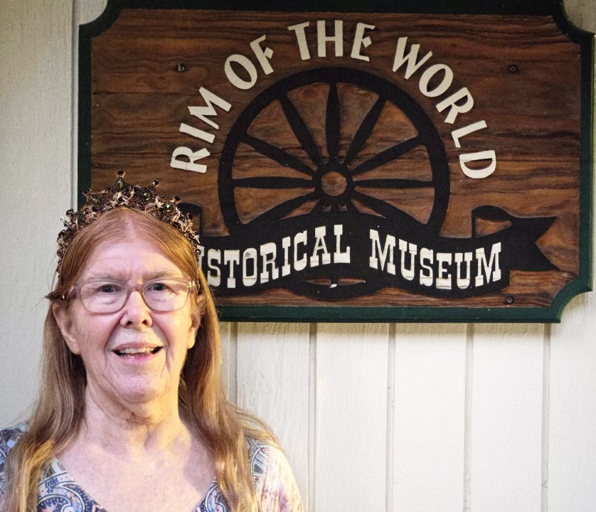 Person outside Rim of the World Historical Museum.