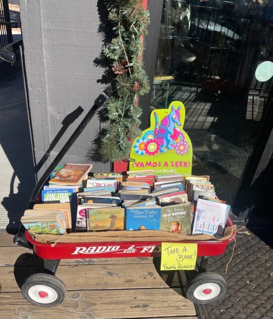 Wagon full of free books for children to pick out and read.