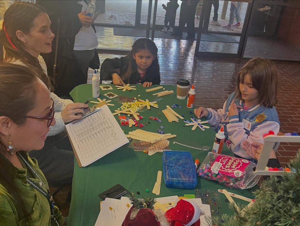 Adrianne, Lisa, Julia, Melissa and Adrianna from Glendora and Orange County enjoyed last year’s Brewfest at Tavern Bay Beach Club so much they couldn’t resist attending this year’s event. (Photos by Douglas W. Motley) Children making crafts with popsicle sticks and pom poms.