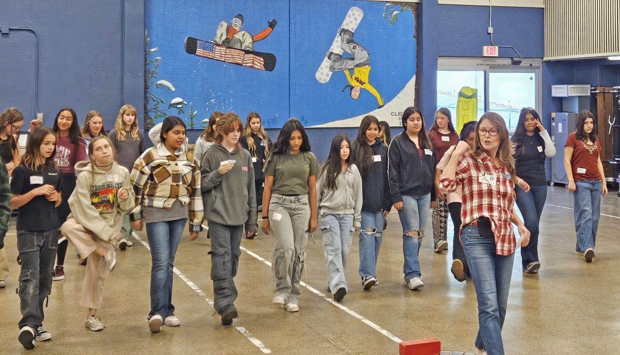 Lupe McDonald led the girls in a line dance. (Photo by Mary-Justine Lanyon)