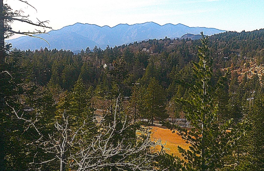 Looking west from a promontory some 300 feet above the trailhead, one can see the elementary school’s athletic field, nearby hills and, silhouetted in the distance, the San Gabriel Mountains.
