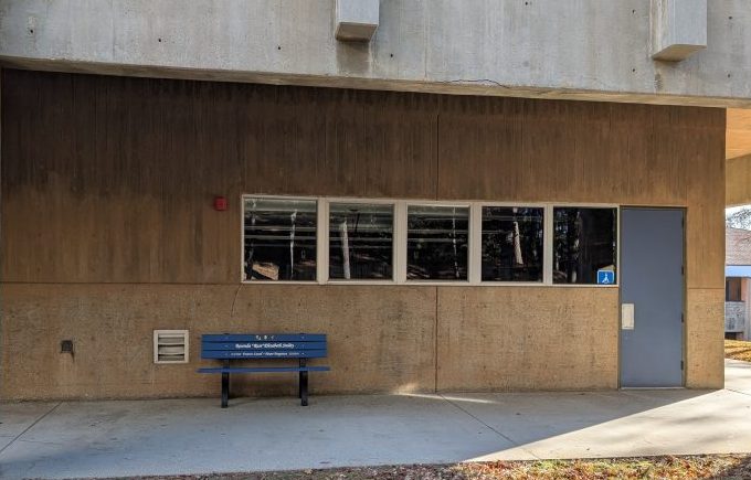 To the right of this bench at MPH is a grassy area where students congregate.