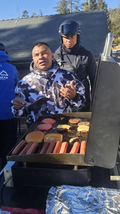 Hector, one of the vets, insisted on cooking the burgers.