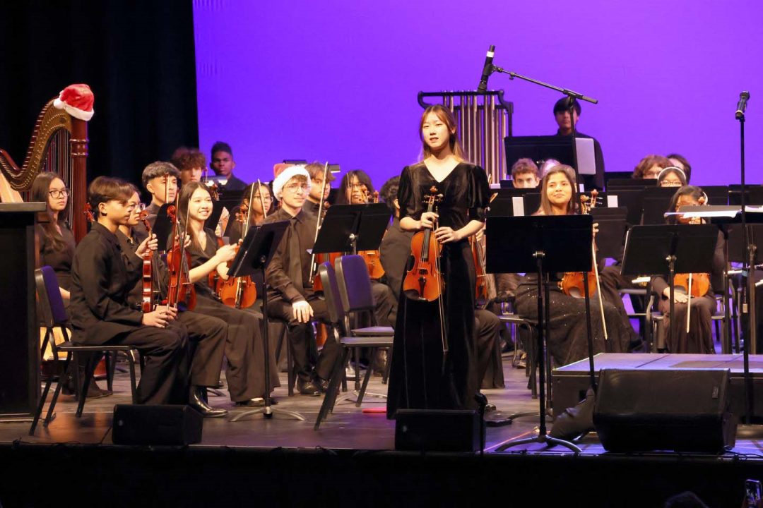Concertmaster Xueyou Melody Ke and the Youth Orchestra.