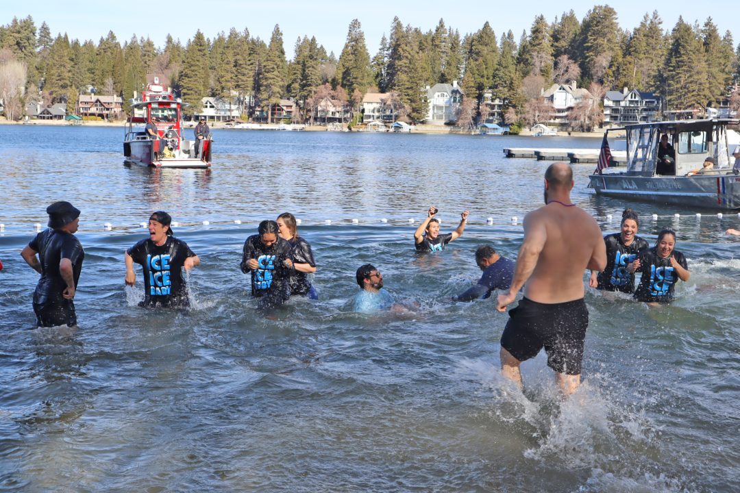 Adrianne, Lisa, Julia, Melissa and Adrianna from Glendora and Orange County enjoyed last year’s Brewfest at Tavern Bay Beach Club so much they couldn’t resist attending this year’s event. (Photos by Douglas W. Motley) People enjoy icy lake swim near boats.