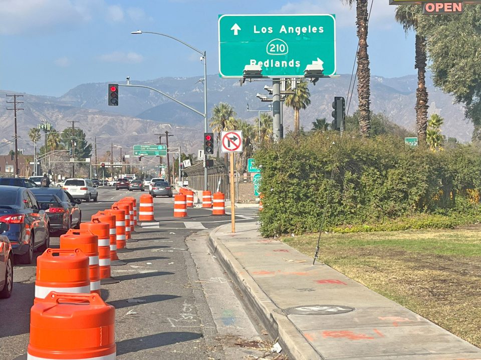 Traffic cones on road near Los Angeles sign