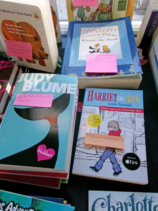 Children's books displayed with sticky notes.