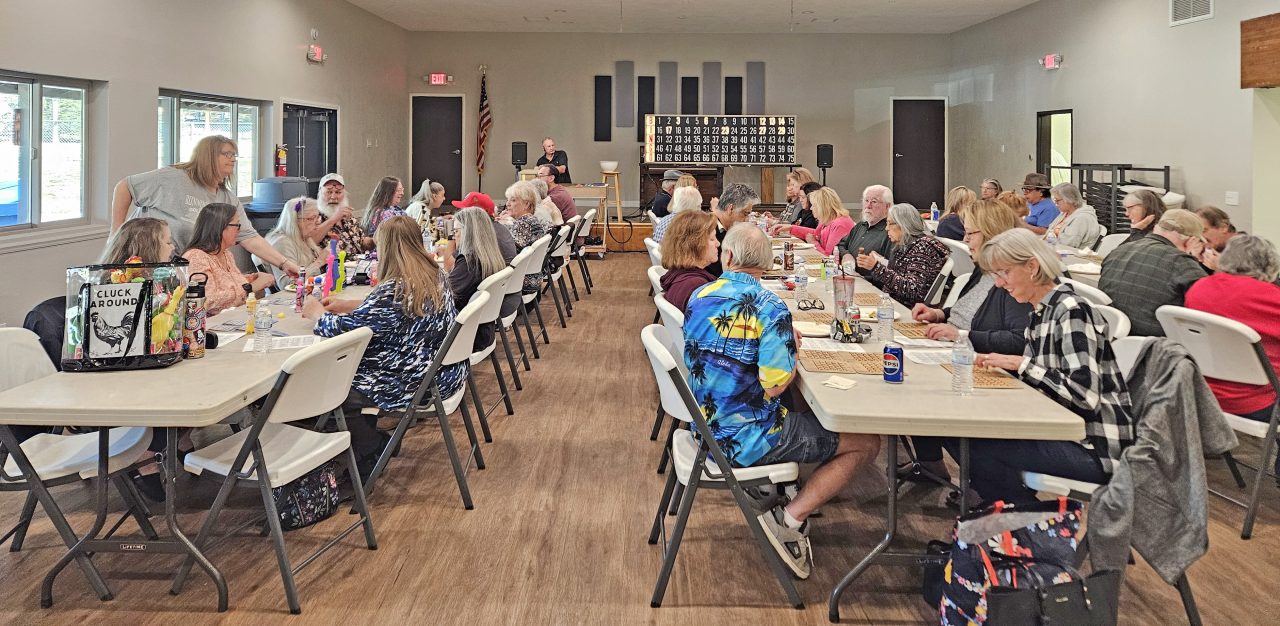 Adrianne, Lisa, Julia, Melissa and Adrianna from Glendora and Orange County enjoyed last year’s Brewfest at Tavern Bay Beach Club so much they couldn’t resist attending this year’s event. (Photos by Douglas W. Motley) Group of people playing bingo in community hall.