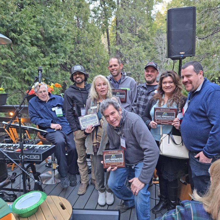 Adrianne, Lisa, Julia, Melissa and Adrianna from Glendora and Orange County enjoyed last year’s Brewfest at Tavern Bay Beach Club so much they couldn’t resist attending this year’s event. (Photos by Douglas W. Motley) Group holding awards outdoors on a deck.