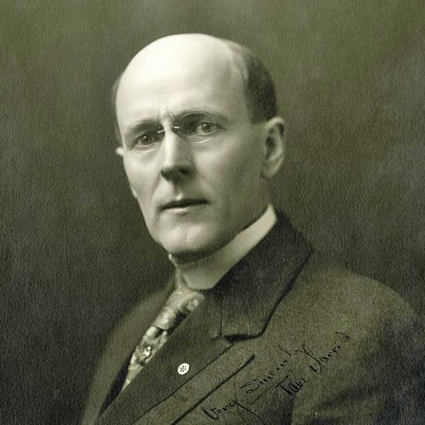 Portrait of a man in a suit and tie.