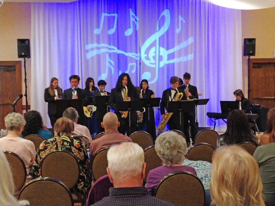 Jazz band performing on stage at a concert.