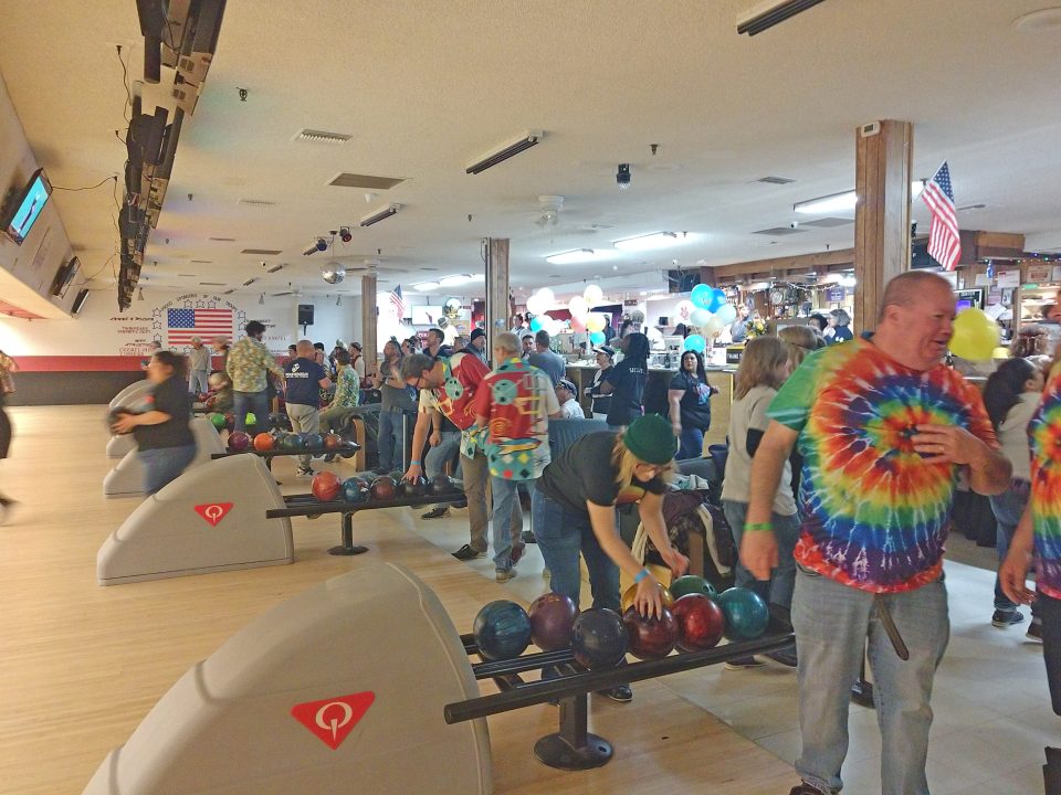 Adrianne, Lisa, Julia, Melissa and Adrianna from Glendora and Orange County enjoyed last year’s Brewfest at Tavern Bay Beach Club so much they couldn’t resist attending this year’s event. (Photos by Douglas W. Motley) People bowling in a busy, colorful bowling alley.