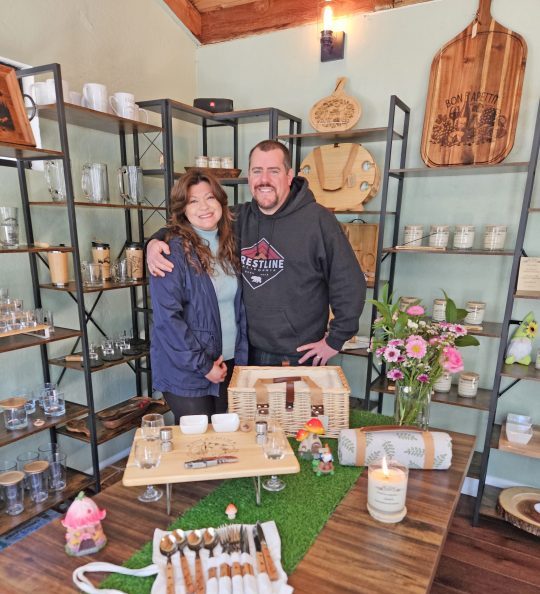 Adrianne, Lisa, Julia, Melissa and Adrianna from Glendora and Orange County enjoyed last year’s Brewfest at Tavern Bay Beach Club so much they couldn’t resist attending this year’s event. (Photos by Douglas W. Motley) Couple smiling in a craft shop with display items.