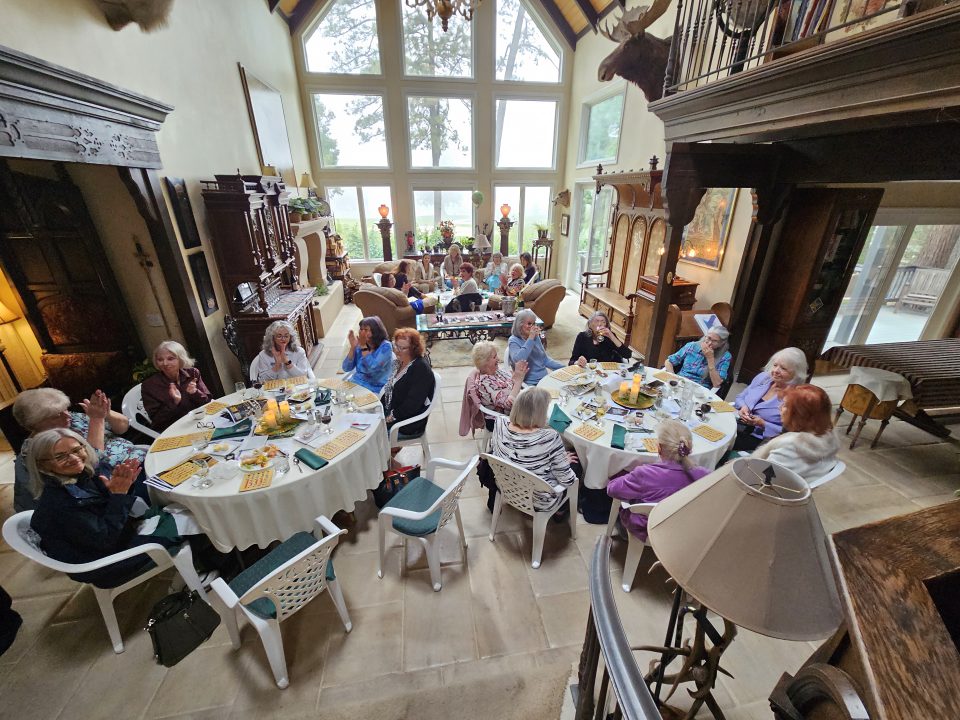 Seniors enjoying a gathering in a spacious room.