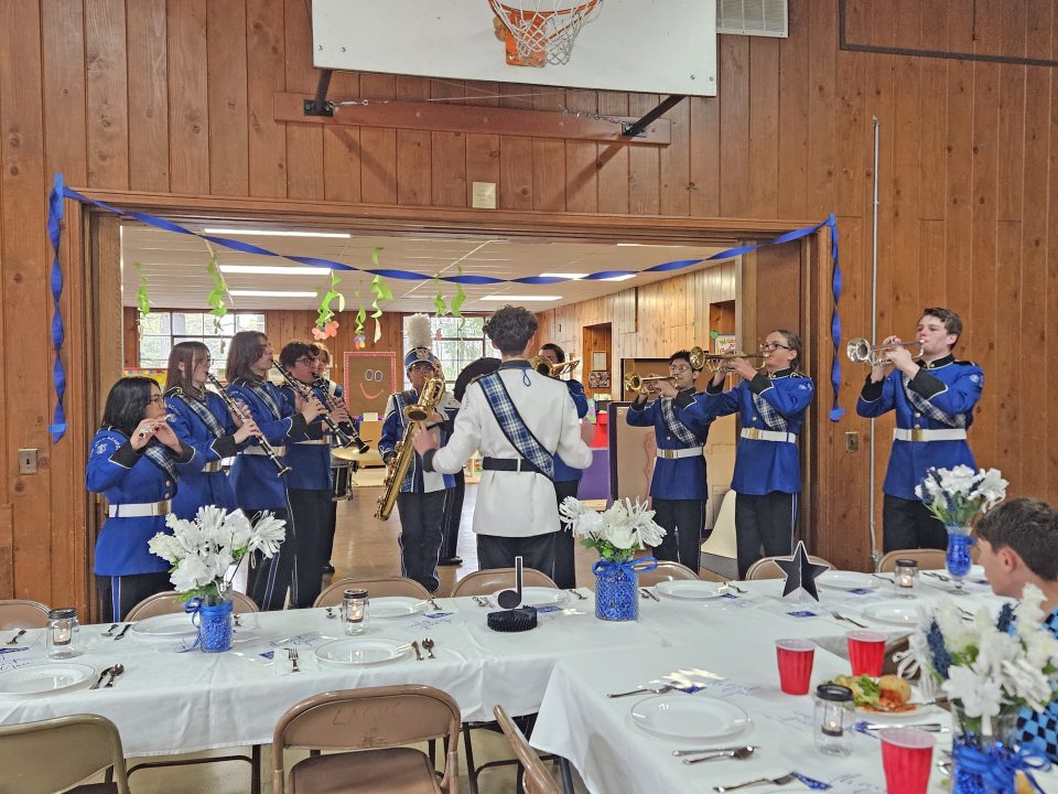 Adrianne, Lisa, Julia, Melissa and Adrianna from Glendora and Orange County enjoyed last year’s Brewfest at Tavern Bay Beach Club so much they couldn’t resist attending this year’s event. (Photos by Douglas W. Motley) Marching band performing indoors at a decorated event.