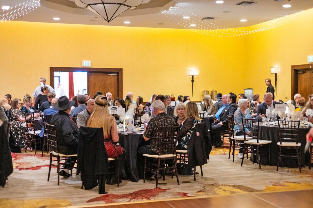 People seated at a formal banquet event.