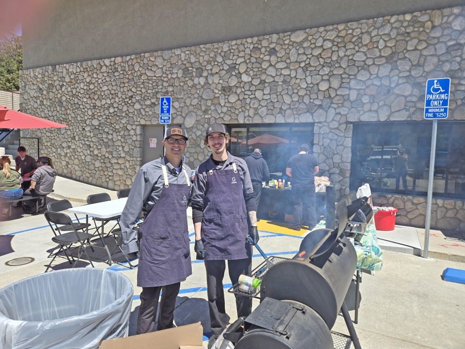 Adrianne, Lisa, Julia, Melissa and Adrianna from Glendora and Orange County enjoyed last year’s Brewfest at Tavern Bay Beach Club so much they couldn’t resist attending this year’s event. (Photos by Douglas W. Motley) Two men grilling outdoors at a barbecue event.