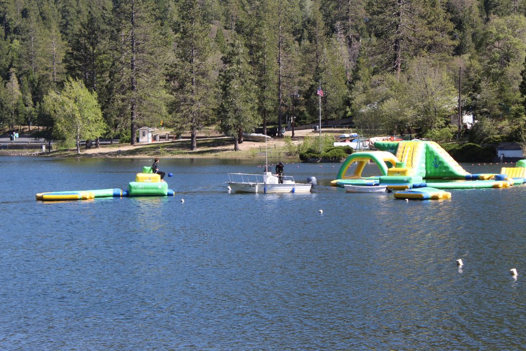 Adrianne, Lisa, Julia, Melissa and Adrianna from Glendora and Orange County enjoyed last year’s Brewfest at Tavern Bay Beach Club so much they couldn’t resist attending this year’s event. (Photos by Douglas W. Motley) Lake with inflatable water park and boat