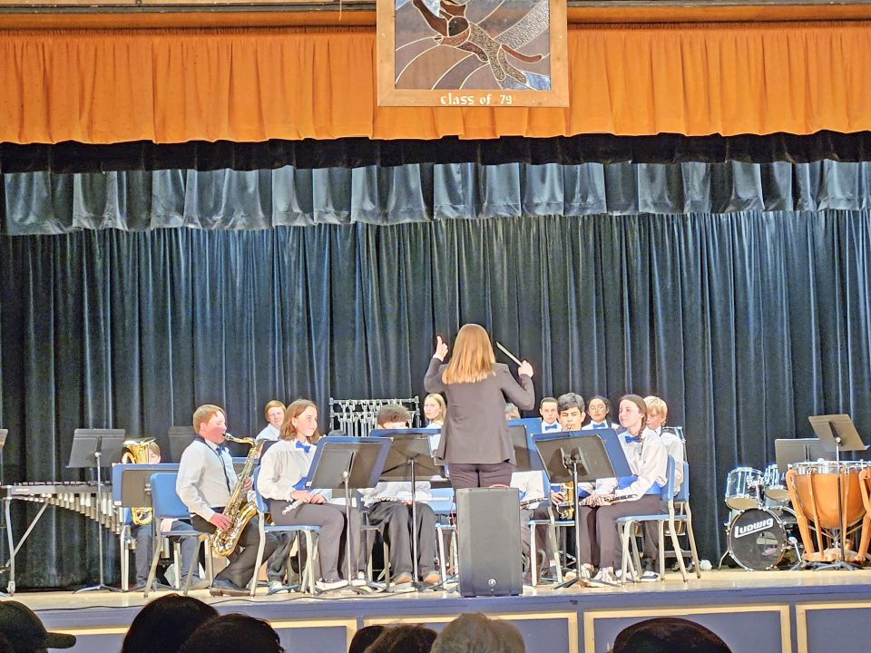 Adrianne, Lisa, Julia, Melissa and Adrianna from Glendora and Orange County enjoyed last year’s Brewfest at Tavern Bay Beach Club so much they couldn’t resist attending this year’s event. (Photos by Douglas W. Motley) School band performance with conductor on stage.