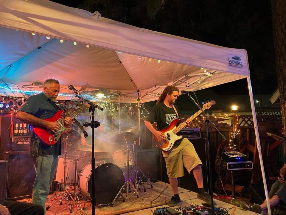 Adrianne, Lisa, Julia, Melissa and Adrianna from Glendora and Orange County enjoyed last year’s Brewfest at Tavern Bay Beach Club so much they couldn’t resist attending this year’s event. (Photos by Douglas W. Motley) Live band performing under lit canopy at night