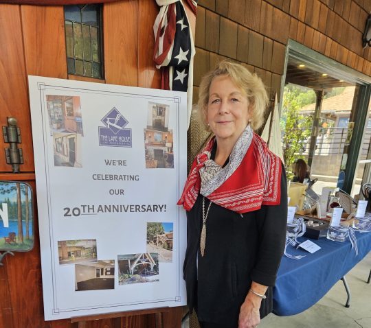 Woman celebrating business 20th anniversary.