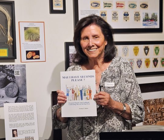 Adrianne, Lisa, Julia, Melissa and Adrianna from Glendora and Orange County enjoyed last year’s Brewfest at Tavern Bay Beach Club so much they couldn’t resist attending this year’s event. (Photos by Douglas W. Motley) Woman holding book at an exhibit display.
