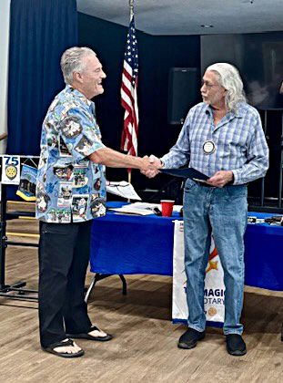 Adrianne, Lisa, Julia, Melissa and Adrianna from Glendora and Orange County enjoyed last year’s Brewfest at Tavern Bay Beach Club so much they couldn’t resist attending this year’s event. (Photos by Douglas W. Motley) Two men shaking hands at a meeting.