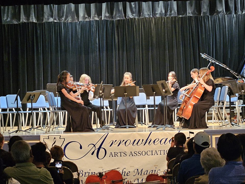 Adrianne, Lisa, Julia, Melissa and Adrianna from Glendora and Orange County enjoyed last year’s Brewfest at Tavern Bay Beach Club so much they couldn’t resist attending this year’s event. (Photos by Douglas W. Motley) String quartet performing on stage with audience.